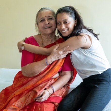 Daughter embracing elderly mother, care begins